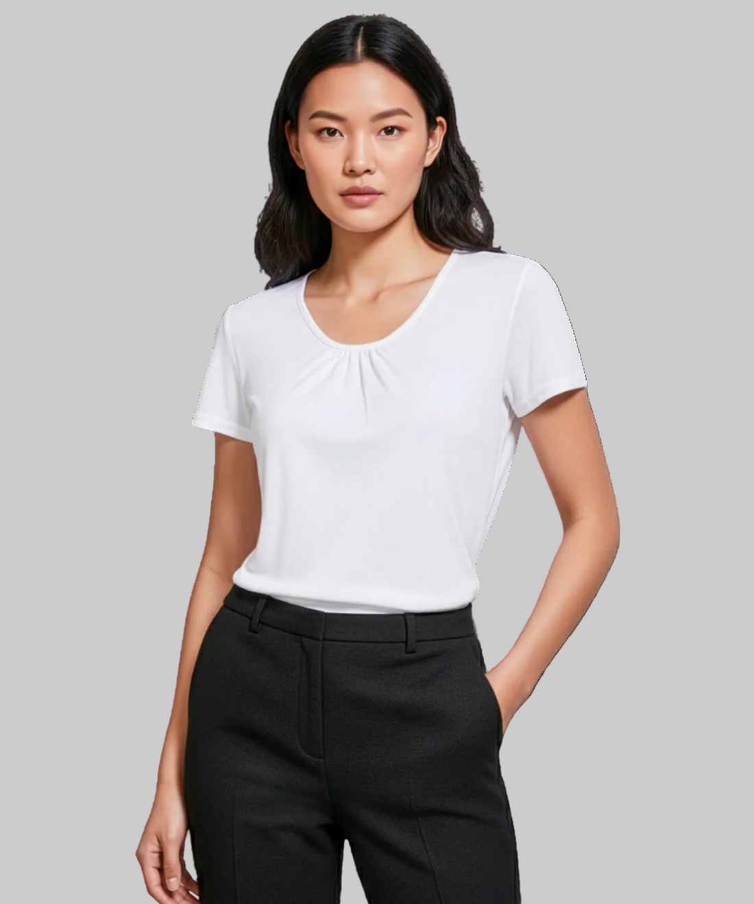 Woman wearing a white t-shirt and black pants on a white background